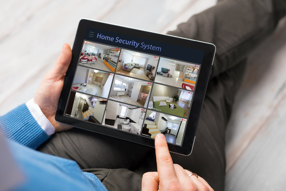 Man Checking His Security Cameras powered by Force Security