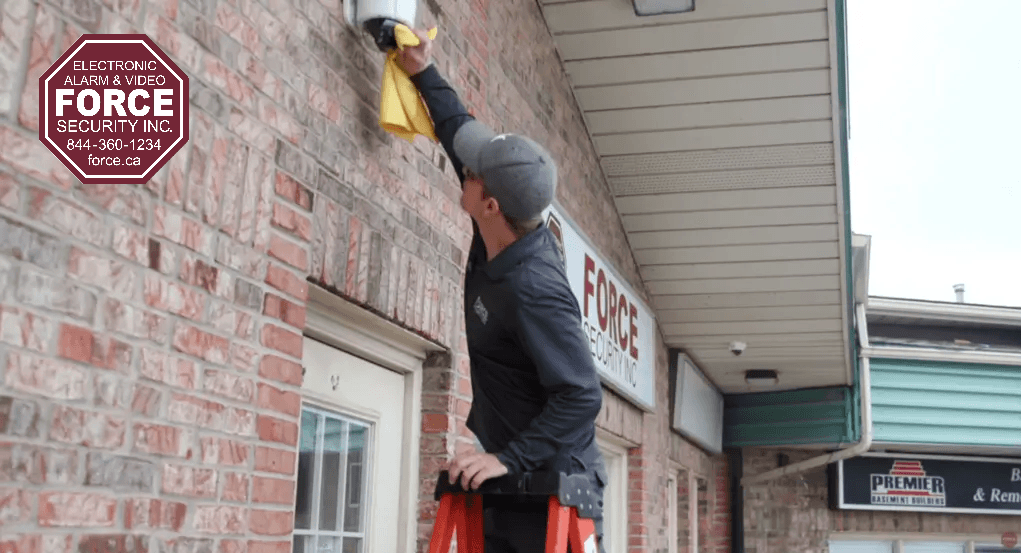 Force Security technician installing a home security system in Ontario.