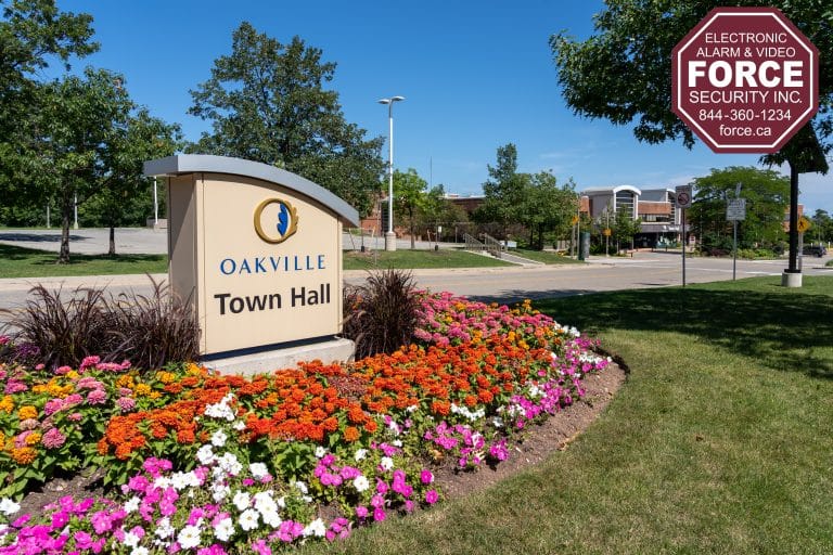 Scenic view of Oakville, Ontario with homes near green spaces and trails, highlighting areas prone to recent break-ins.