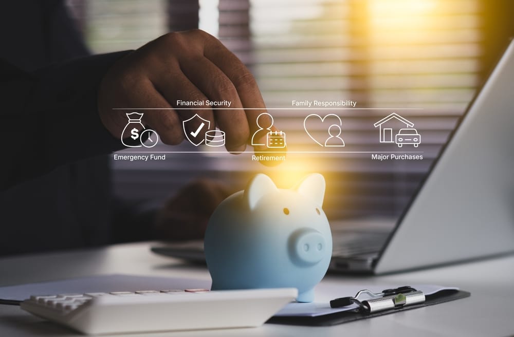 Calculating home insurance discount savings from a monitored alarm system on a laptop with a glowing security icon